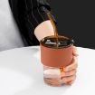 Picture of Glass Tumbler with Silicone Straw and Lid 400 ml Glass Reusable Coffee Mug with Heat Resistant Leather Band Glass Tumbler with Straw and Leakproof Lid Drinking Cup for Coffee, Tea, Milk Hot & Cold Beverages 435ml