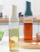 Picture of Auto Flip Glass Oil Bottles Automatic Opening And Closing Olive Oil Seasoning Oil Dispenser Bottle Automatic Leakproof with Drip Free Cap olive Oil Bottles for Kitchen Baking